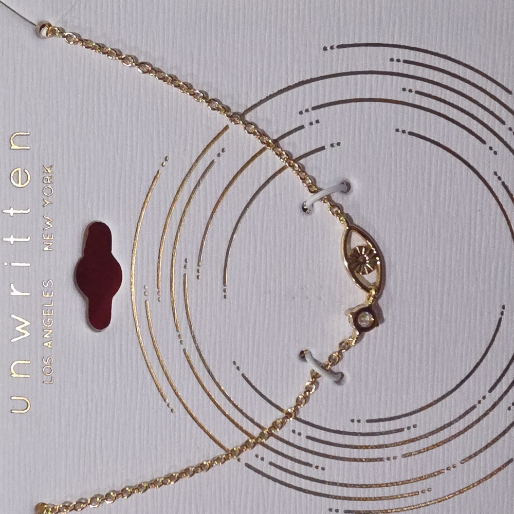 Unwritten Gold and White Evil Eye Necklace